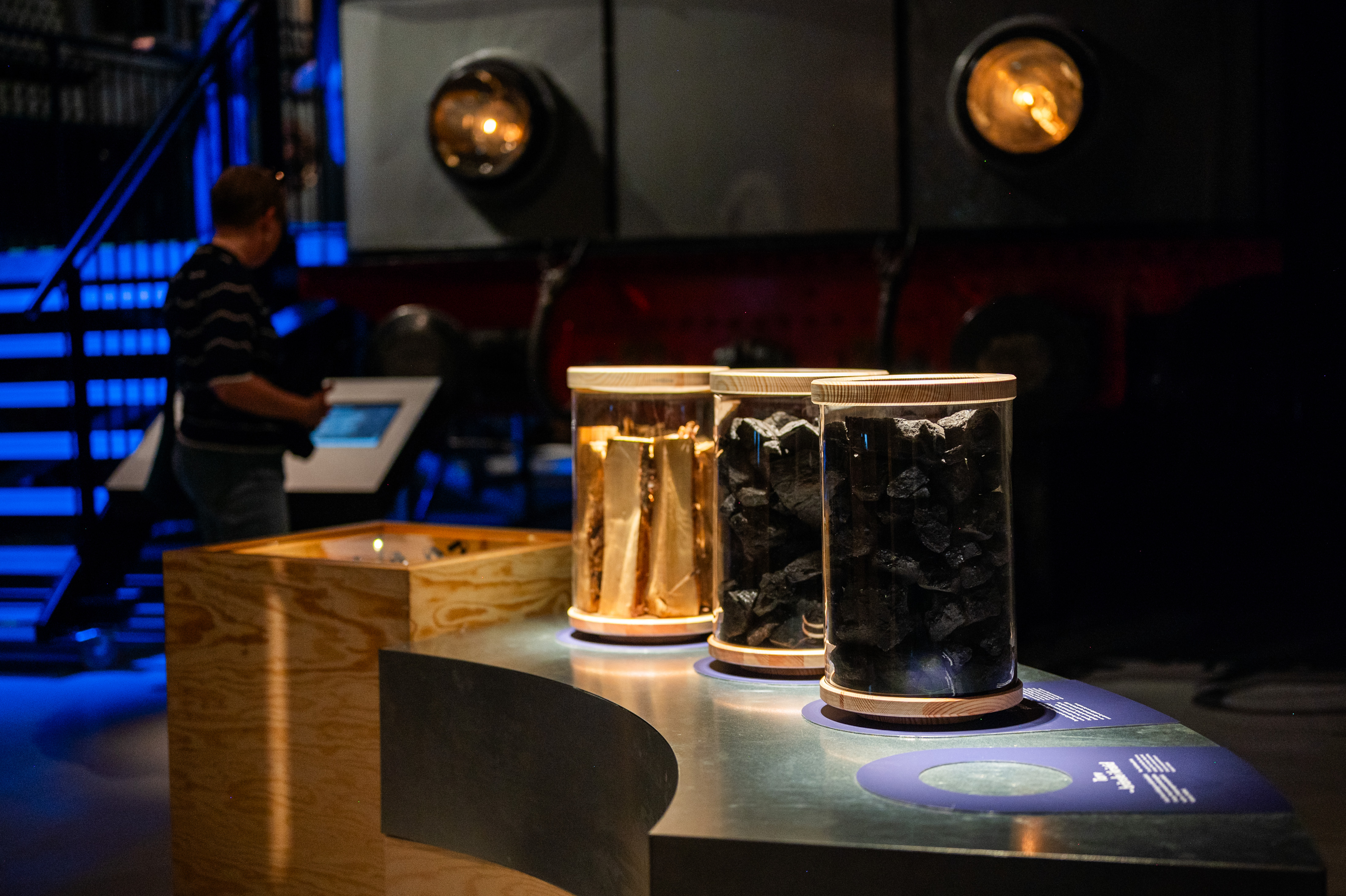 Three glas jars with different types of fuel are standing next to each other